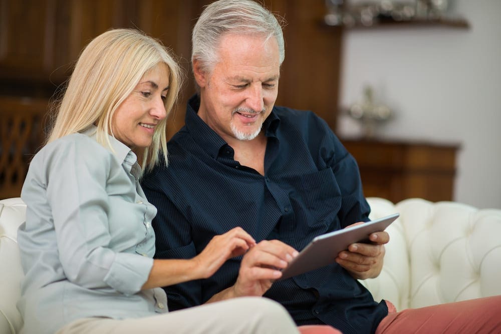 Senior couple using tablet