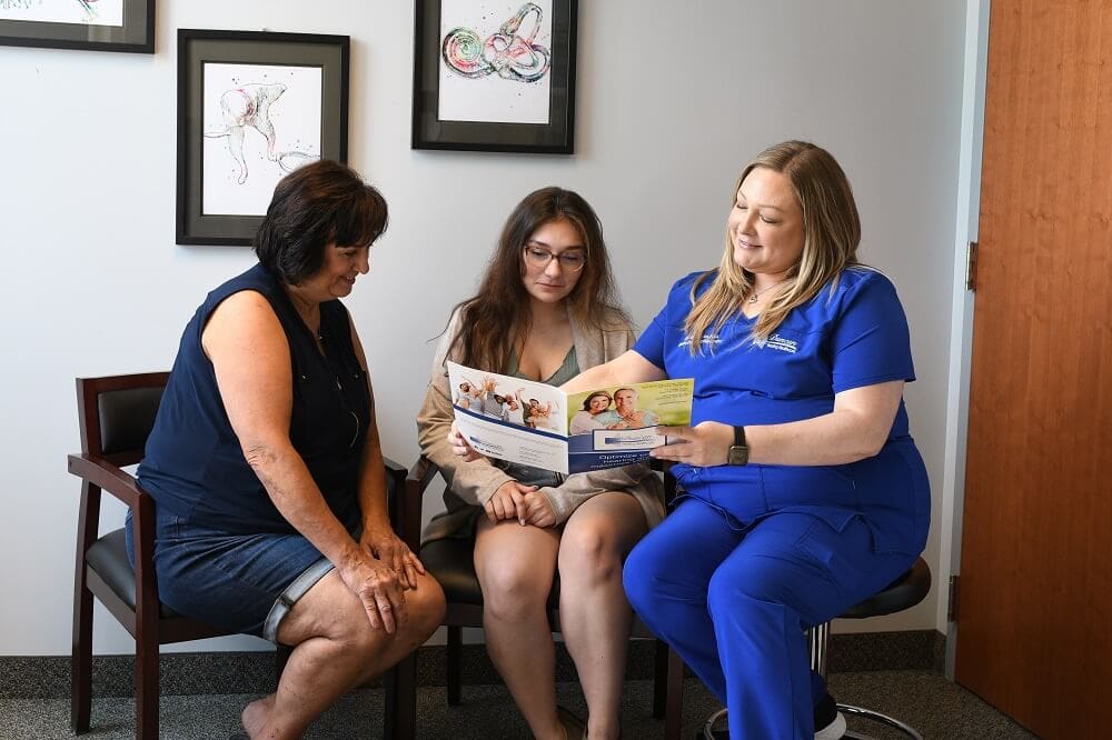 Detecting Cognitive Function Decline with Cognitive Screening Our Hearing Instrument Specialist, Kimberly Duclos, with Two Patients